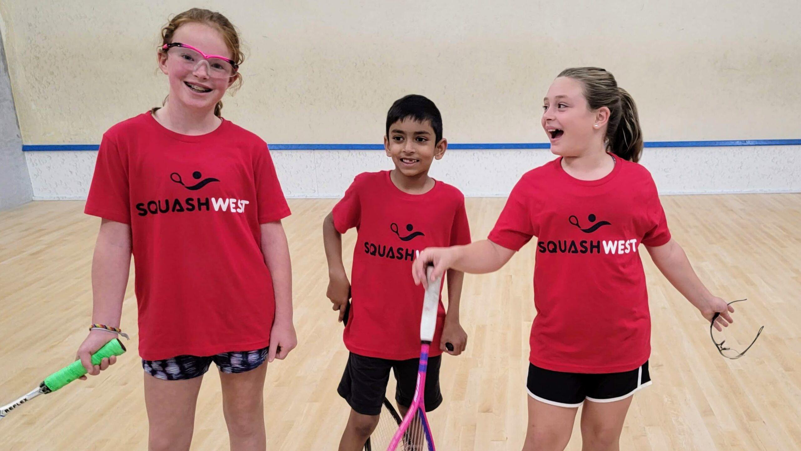 squash kids in red shirts